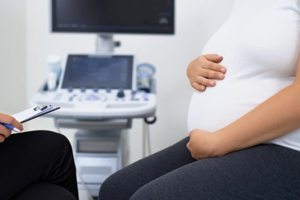 Close up of pregnant woman having medical checkup