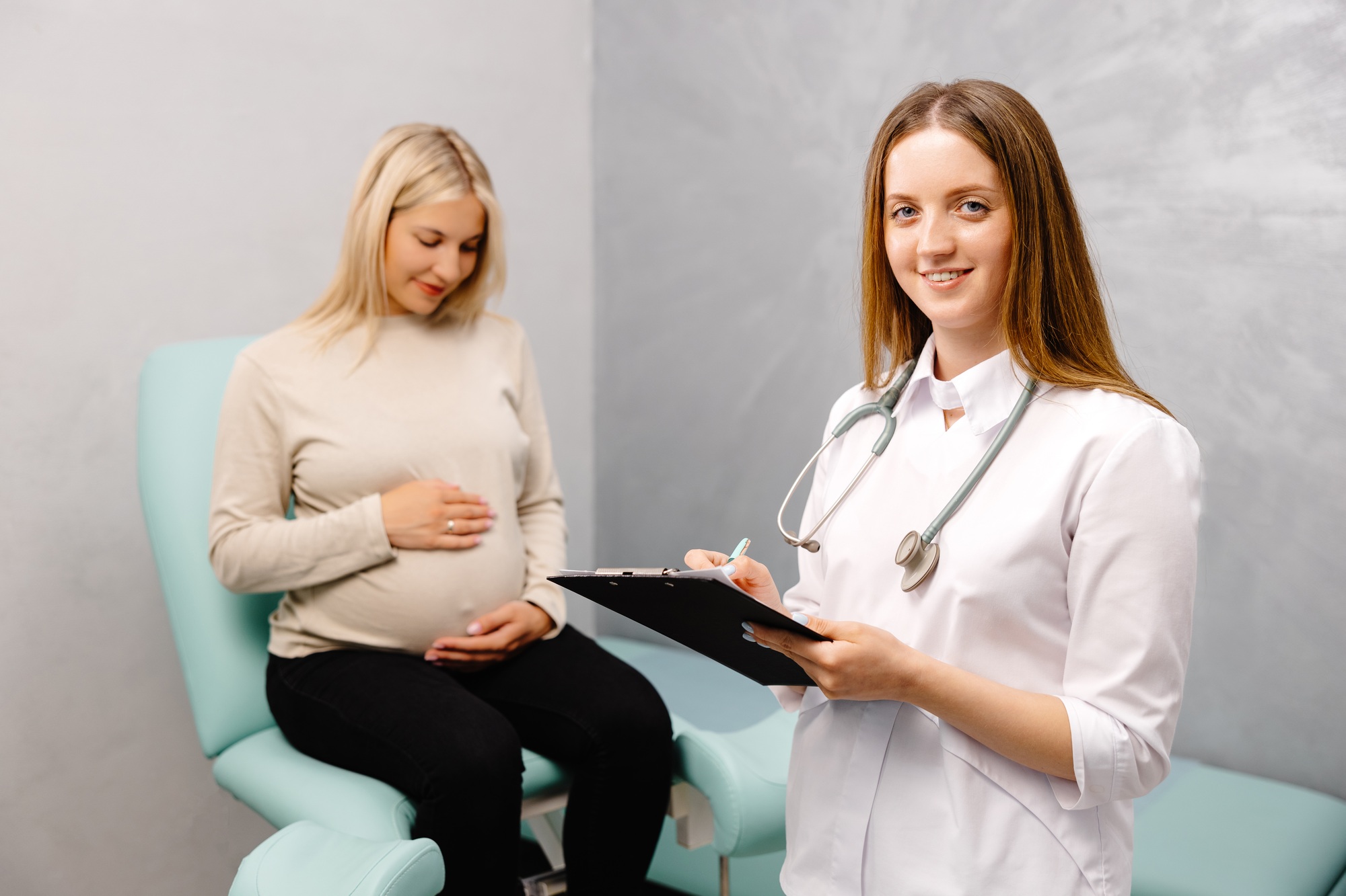 Gynecologist talking with patient during a medical consultation in the gynecological office